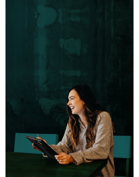 A woman holding a tablet